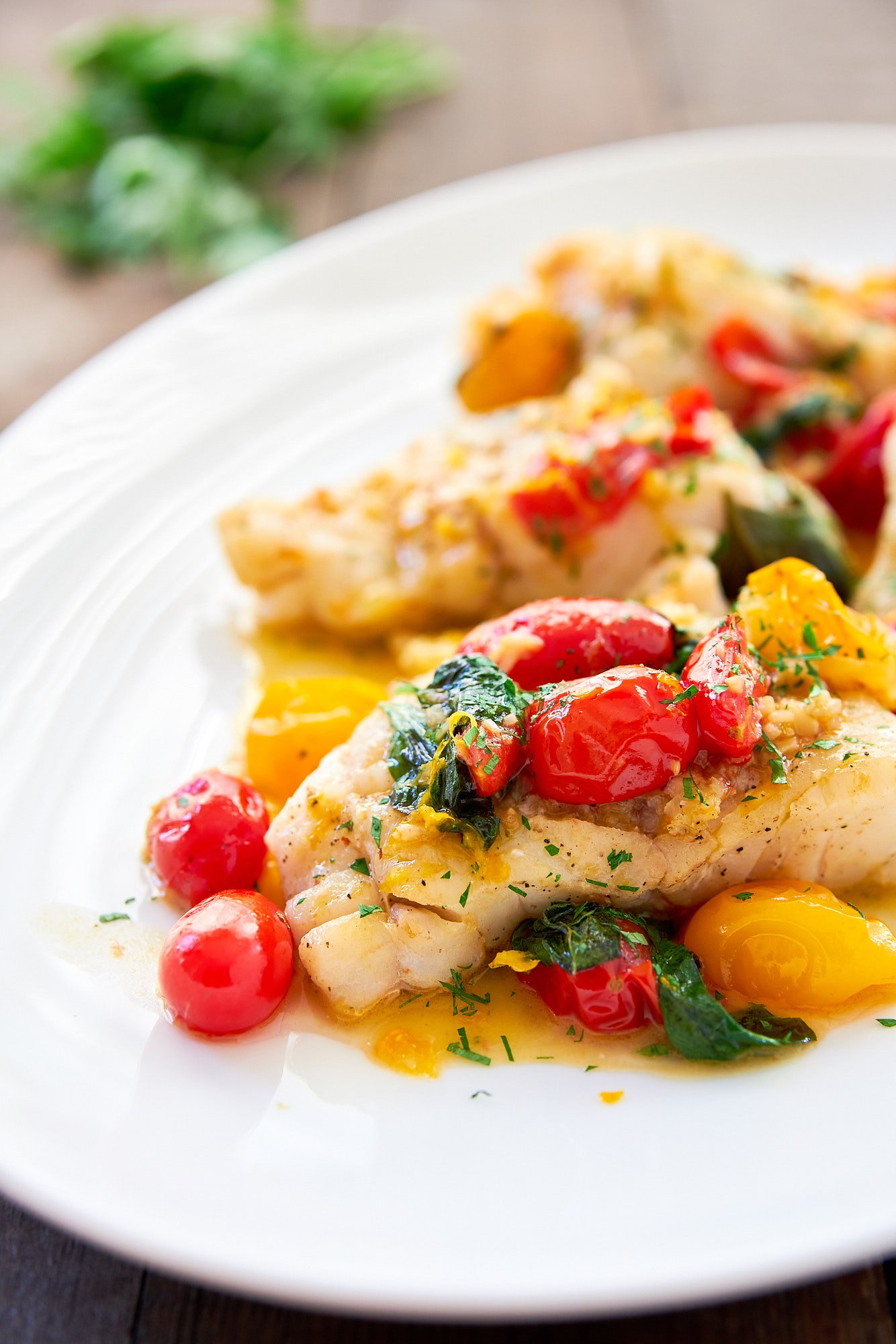 This pan-roasted cod is super easy and delicious! The trick is to make a flavorful pan sauce with cherry tomatoes, basil and white wine. 