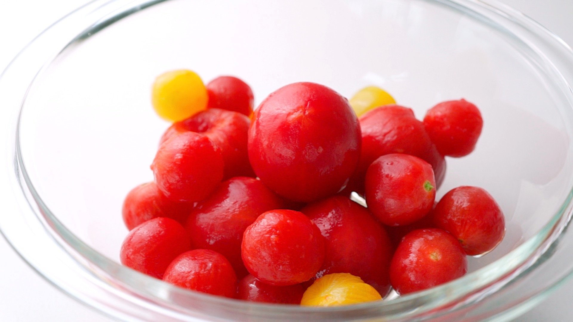 Bowl of peeled tomatoes.