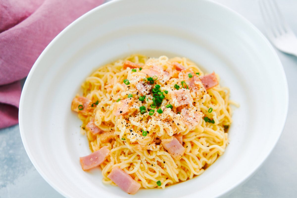 Ramen Carbonara made from instant noodles egg, bacon, and cheese.