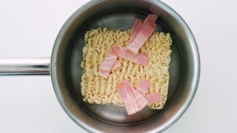 Ramen noodles with bacon and water.