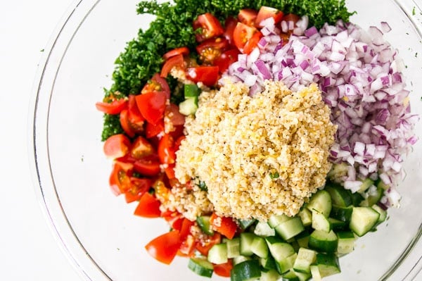 Ingredients for Tabouleh ready to mix in a glass bowl.