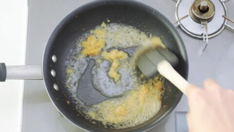 Deglazing pan with sake.