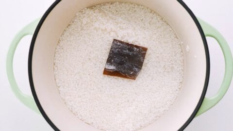 Rice in Dutch oven with sake and konbu.