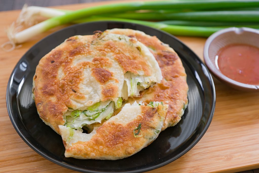 Scallion pancakes made with crisp flaky dough, loaded with sweet spring onions on the inside.