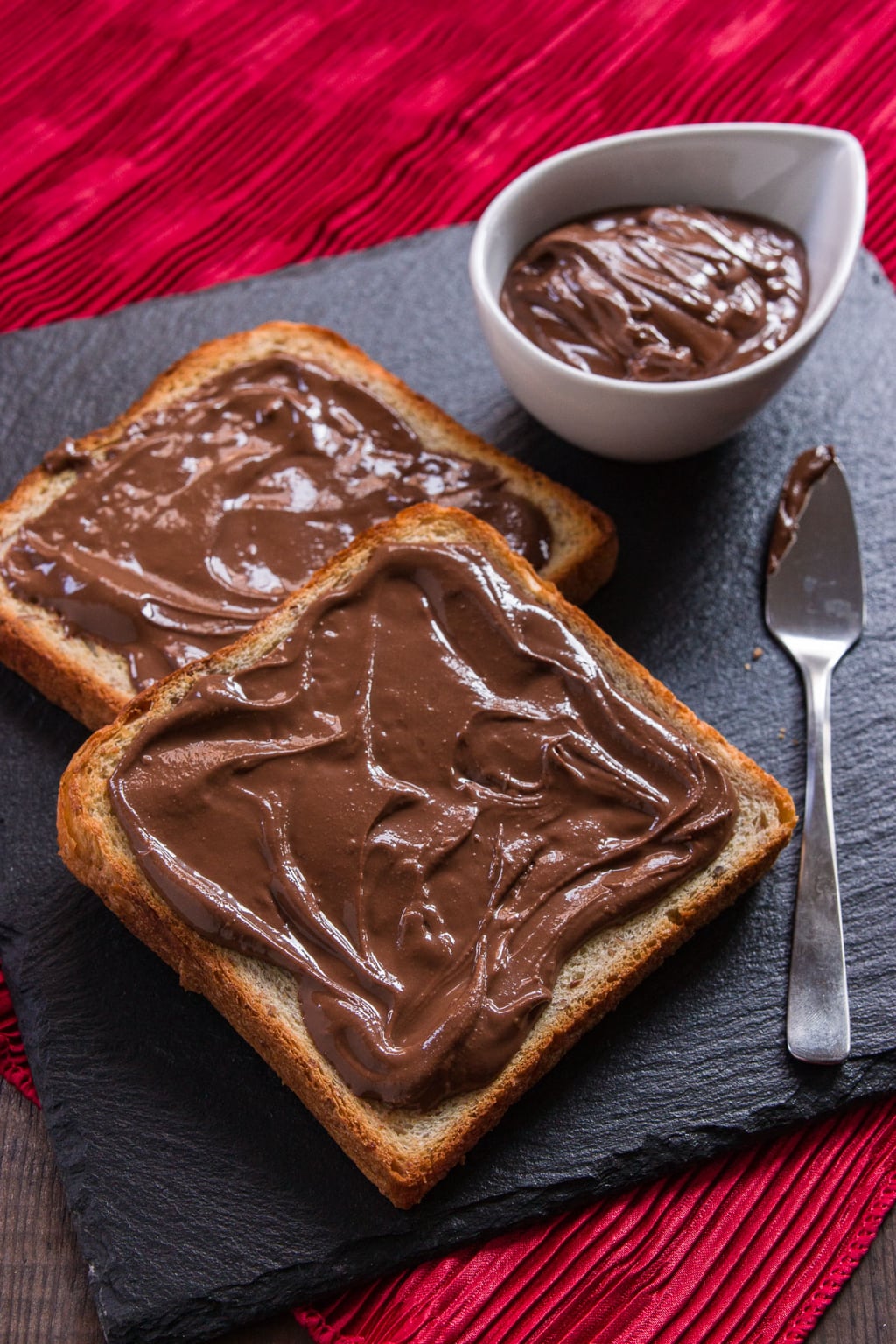 This chocolate sesame butter is smooth and creamy loaded with the rich nutty of sesame seeds for a decadent spread that goes with bread, pancakes, and french toast. Best of all, it only requires 4 ingredients and 5 minutes of your time to make.