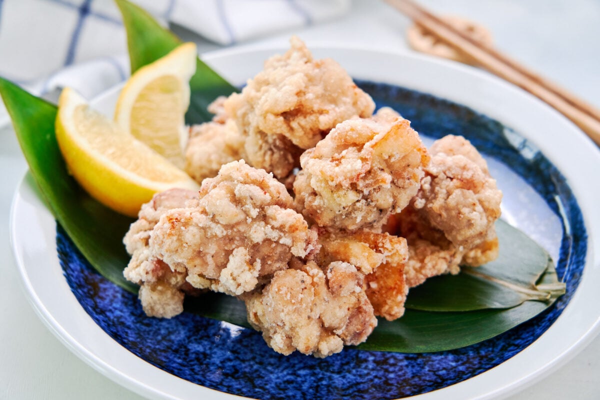 Marinated with sake, salt, and pepper and served with a squeeze of lemon, this ultra-crispy chicken karaage is a delicious Japanese fried chicken.