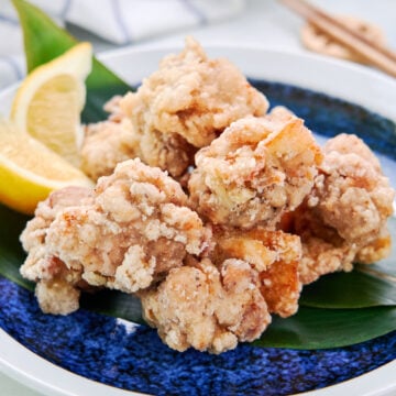 Marinated with sake, salt, and pepper and served with a squeeze of lemon, this ultra-crispy chicken karaage is a delicious Japanese fried chicken.