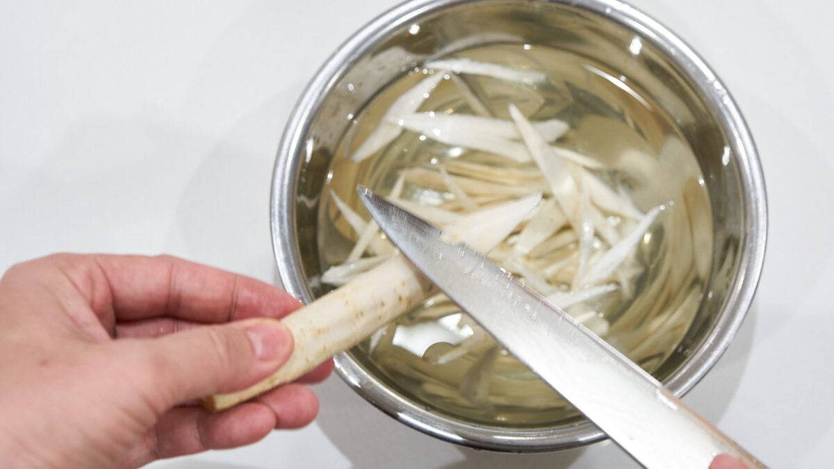 Shaving burdock (gobo) for tonjiru soup.