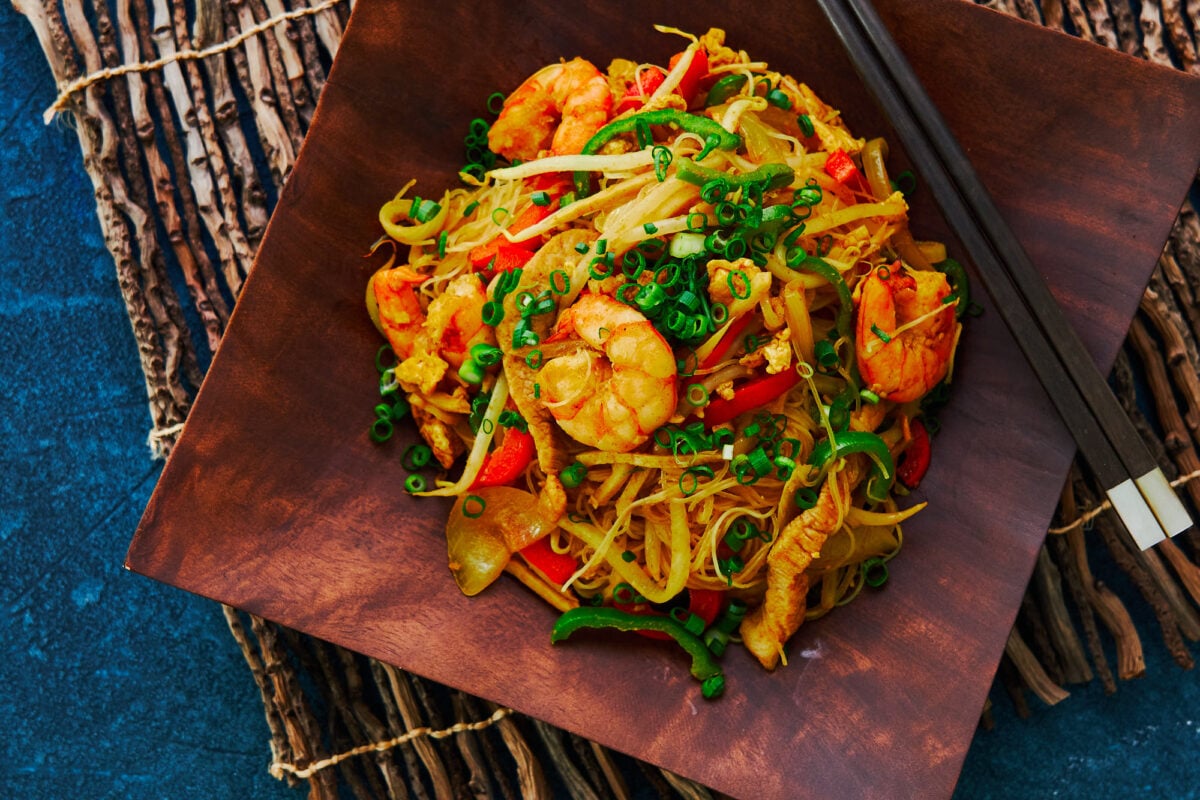 A Chinese-American classic, these "Singapore" Noodles are loaded with shrimp pork and vegetables, stir-fried with curry-flavored rice noodles.