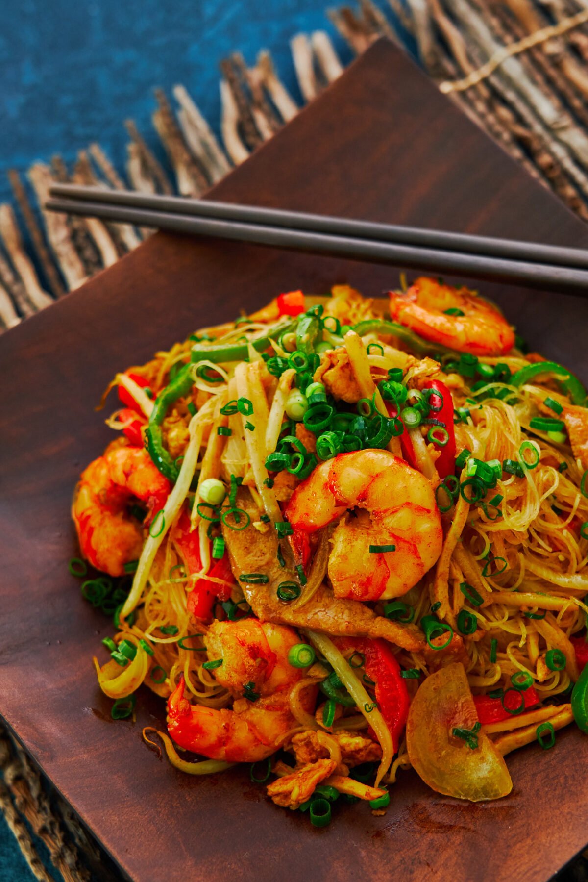 It may not be from Singapore, but this "Singapore" Noodles recipe makes a delicious stir-fry that's loaded with savory shrimp and crisp veggies.