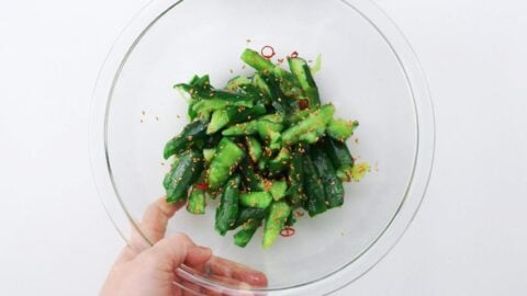 Smashed cucumbers seasoned with toasted sesame oil, soy sauce, and sesame seeds.