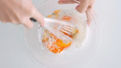 Whisking eggs, cheese and black pepper for Carbonara Sauce.