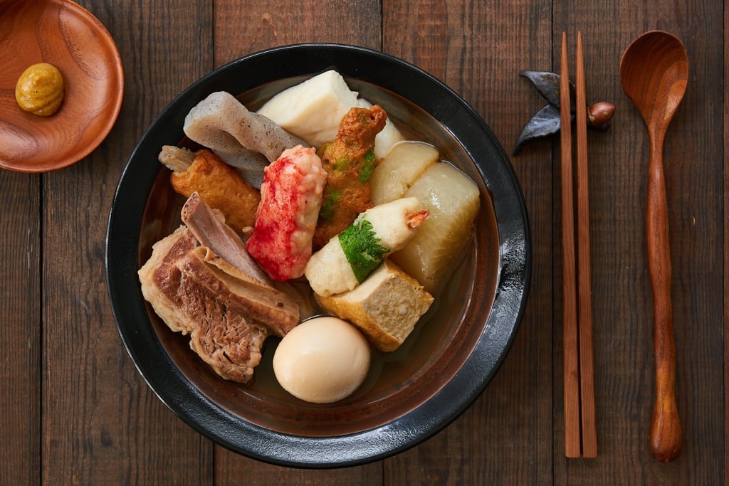 Oden is a Japanese stew with a wide variety of meat, vegetables, tofu, and fishcakes simmered in a mild dashi broth until tender. 