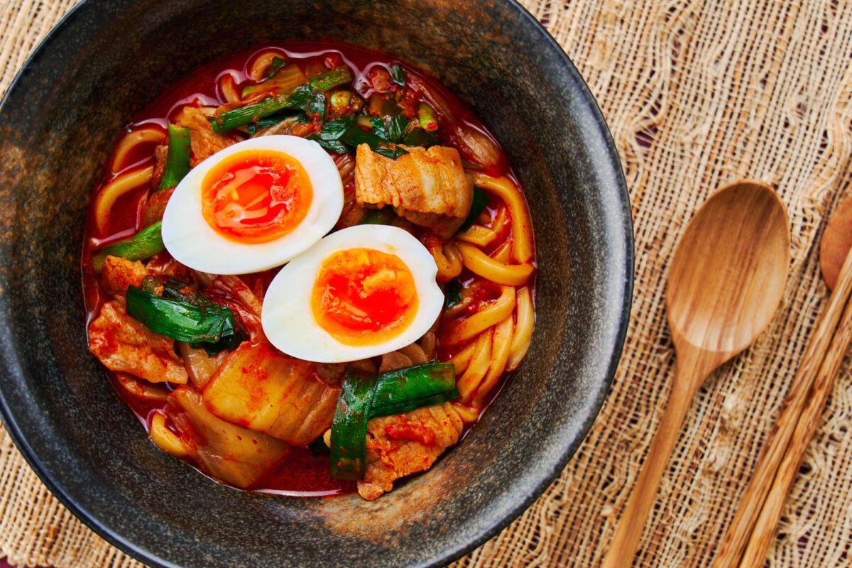 Spicy udon noodle soup with a pork and kimchi broth.