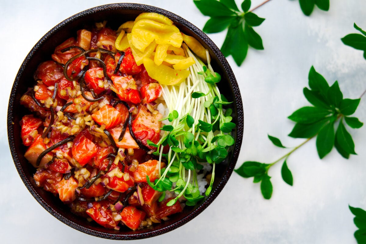 This spicy salmon rice bowl is loaded with umami and redolent of fresh yuzu with a spicy green chili kick.