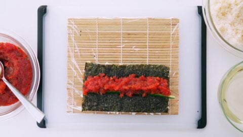 Spicy tuna mixture and cucumber on nori.