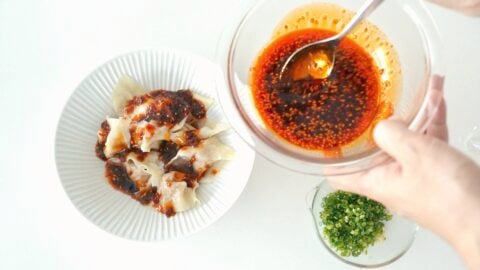 Chili oil sauce and scallions for Sichuan-style spicy wontons.