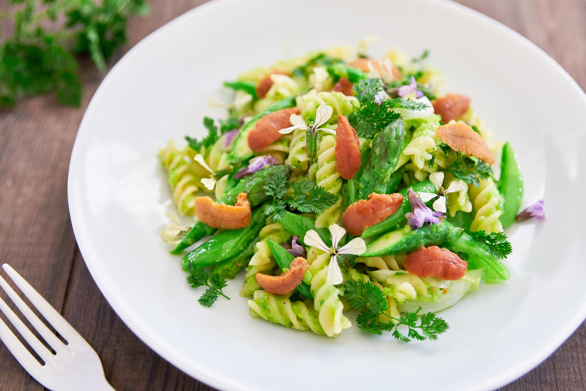 The unbeatable combo of spring veggies with pasta tossed in a creamy green pea pesto makes this drool-worthy spring pasta one of my favorites.