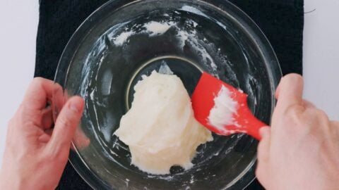 Knead the mochi dough until a smooth elastic ball forms.