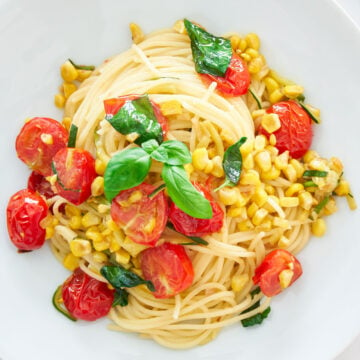 This easy Summer Pasta captures the essense of the season with sweet pan-roasted tomatoes, crisp corn, and tender zucchini tossed with garlic, basil, and spaghettini.