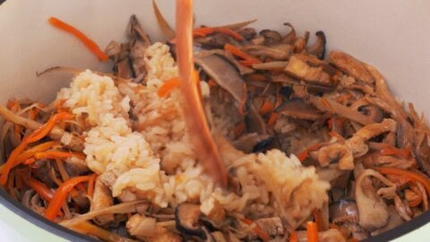 Mix the mushrooms and veggies into the rice.