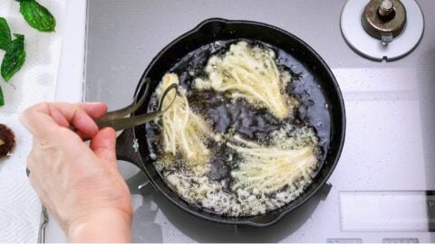 Tempura Enoki frying in oil.