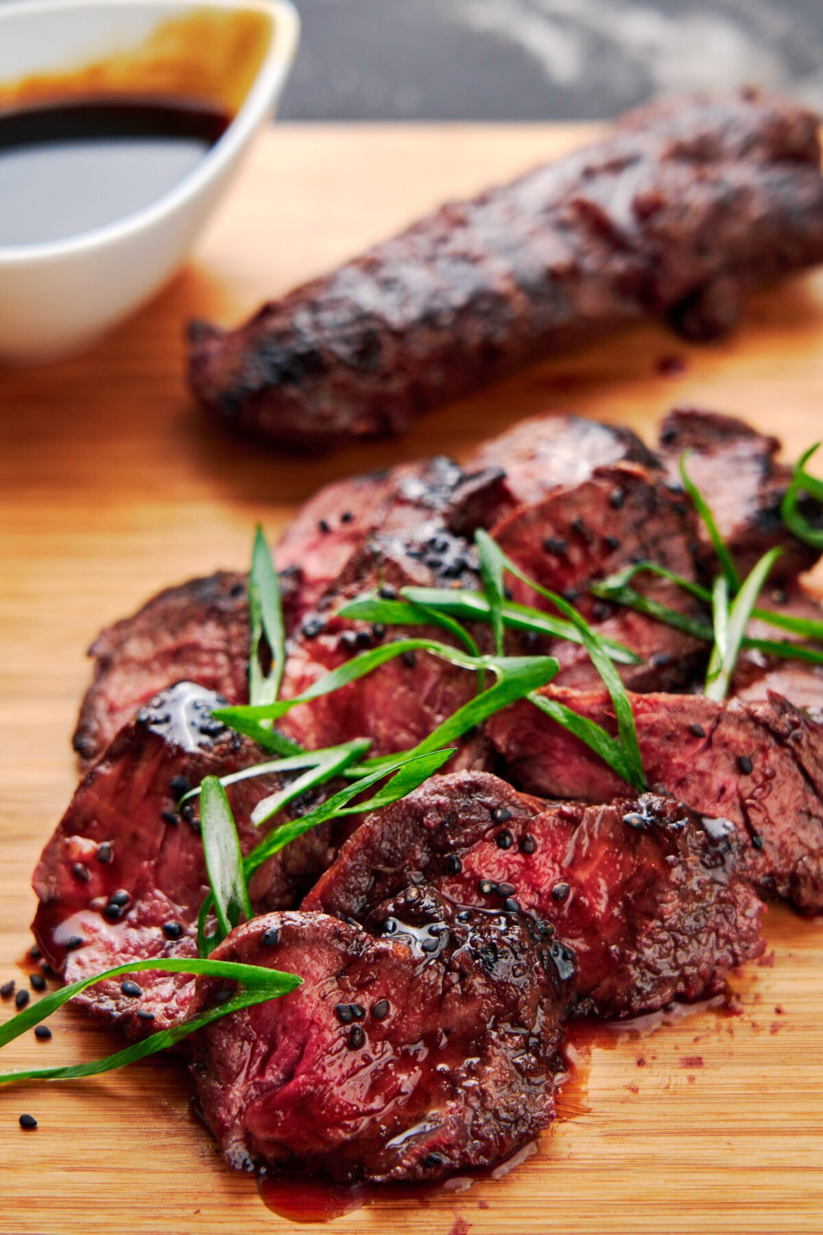 Grilled hanger steak marinated with ginger and garlic and glazed with a simple 3 ingredient teriyaki sauce.