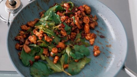 Tossing Holy Basil with Chicken for Pad Kraprow Gai