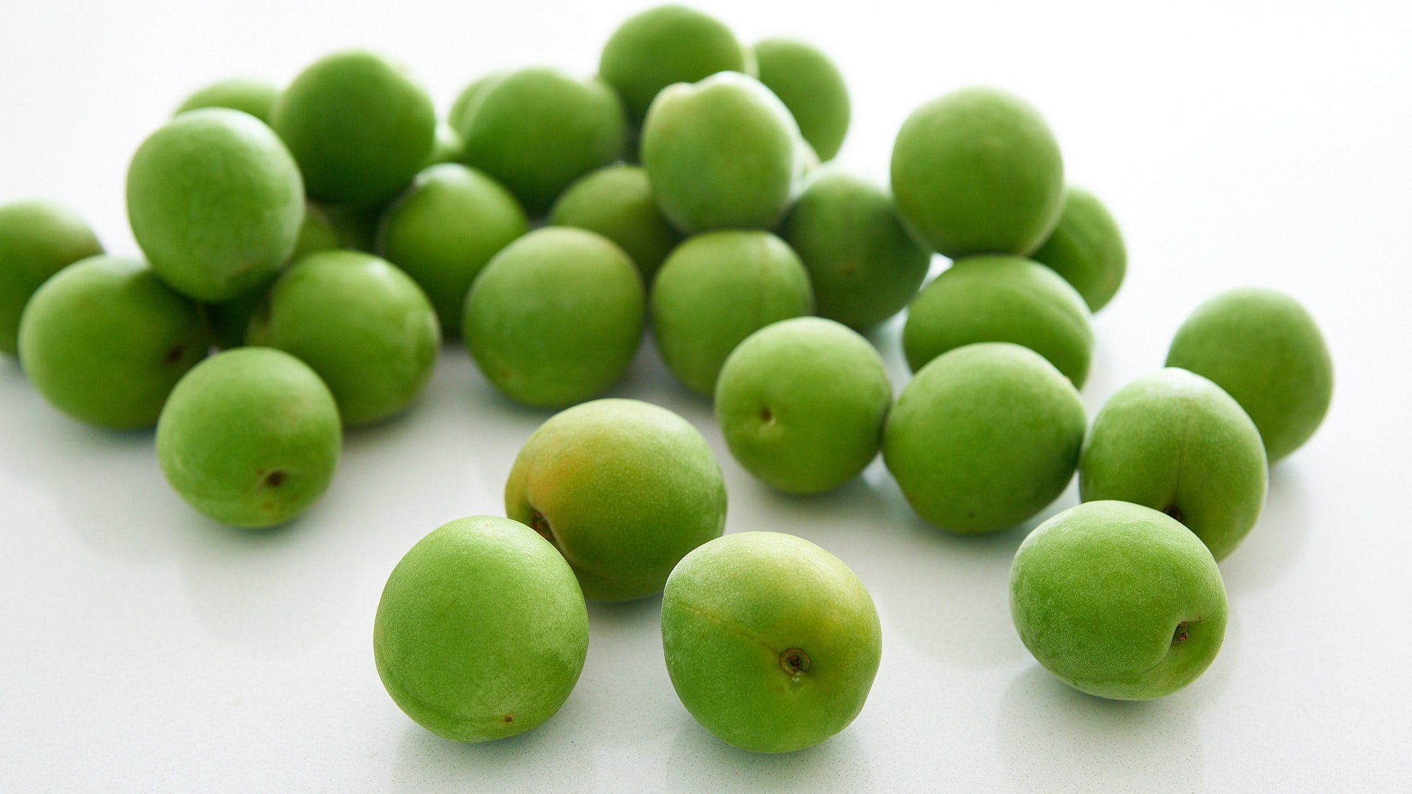 Fresh green ume fruit is a member of the Prunus genus and related to Apricot.