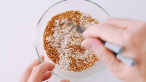 Mix sesame seeds into the oat and mushroom mixture.