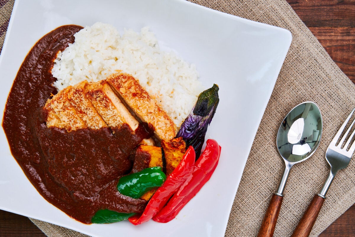 This plate of Japanese Katsu Curry, which includes rice, crispy tofu katsu, and a spicy and flavorful Japanese curry sauce, is vegan and vegetarian friendly.