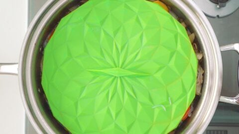 Green silicone drop lid used on top of a pot of Nikujaga.