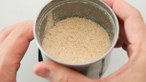 Cashew nuts ground into crumbs to make vegan cheese.