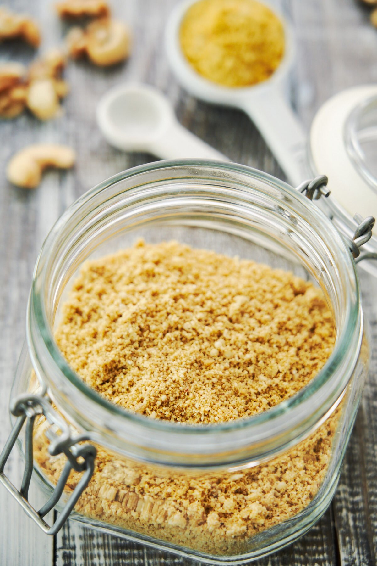 This easy 5 ingredient plant-based parmesan cheese sprinkles like parmesan, tastes like parmesan and makes any dish you add it to taste better.