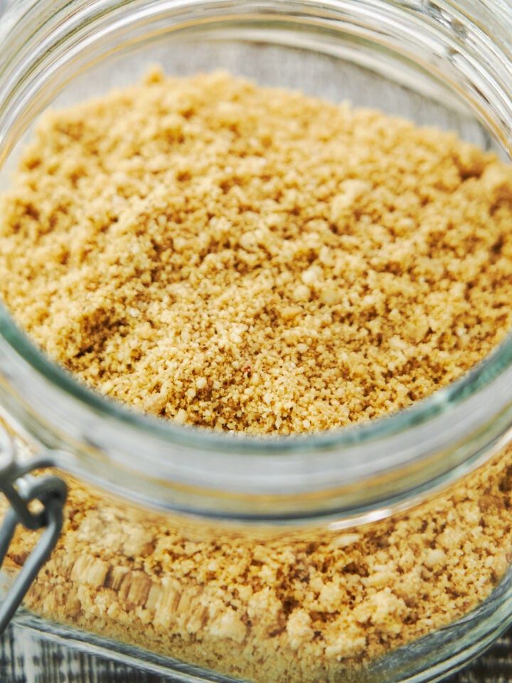 This easy 5 ingredient plant-based parmesan cheese sprinkles like parmesan, tastes like parmesan and makes any dish you add it to taste better.