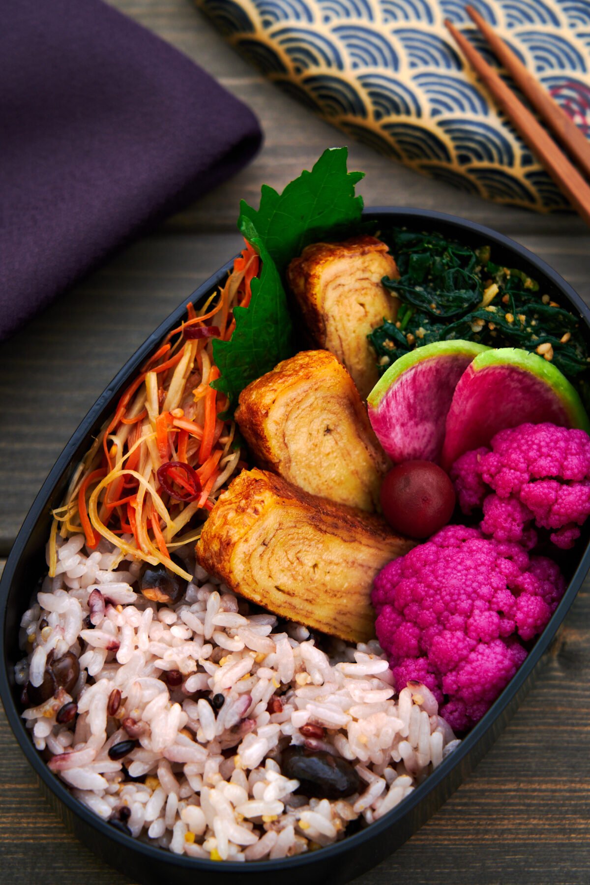 With a different taste, texture, or flavor in every bite, this vegan-friendly bento box features a plant-based tamagoyaki along with a rainbow of veggie sides.