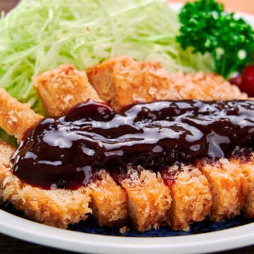 Vegan tofu katsu glazed with a spicy sweet homemade katsu sauce.