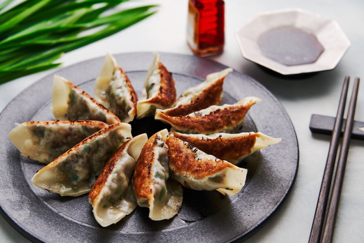 Crispy pan-fried vegetable Japanese dumplings with gyoza dipping sauce.